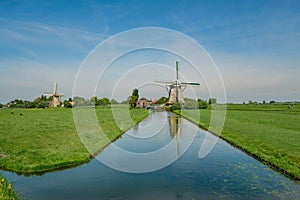 Two wind mills in a polder landscape near Rotterdam