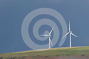 Two Wind turbines on a hill