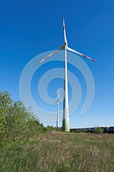 two wind turbines to generate electricity in a landscape in Magdeburg in Germany