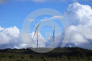 Two Wind Turbines under beautiful cloudy sky