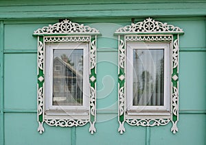 Two windows with carved platbands