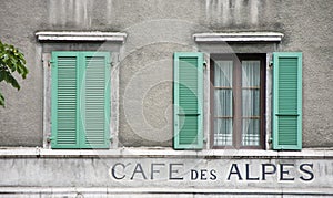 Two windows and green shutters