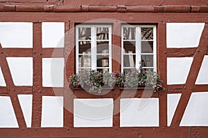 Two windows in a half-timbered house