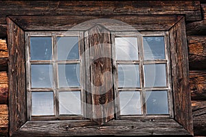 Two windows of a log house