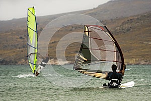 Two windsurfers