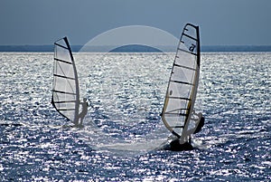 Two windsurfers