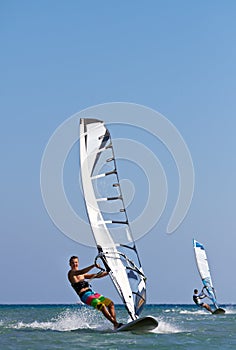 Two windsurfers in action