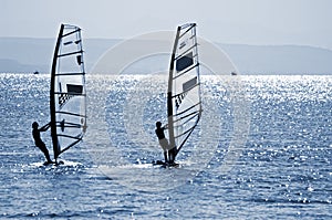 Two windsurfers