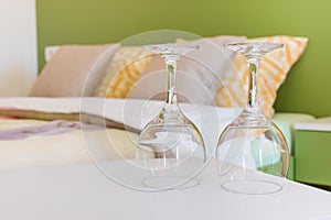 Two wine glasses in bedroom