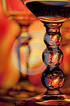 Two wine glasses with orange background