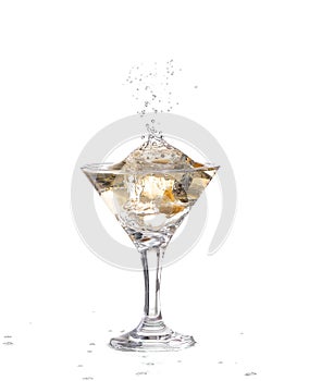 two wine swirling in a goblet martini glass,