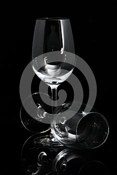 Two wineglass on a black background