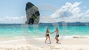 Two woman dancing on the beach