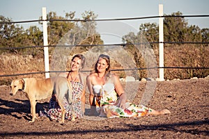 Two woman horse and dog outdoor in summer happy