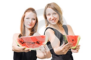 Two woman with lobule of watermelon