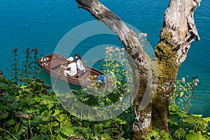 Two woman paddeling along the lakes at plitvice national park