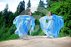 Two woman, twins in the forest