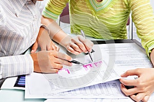 Two woman working on statistic