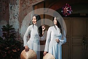 Two women beautiful wearing Ao Dai Vietnamese