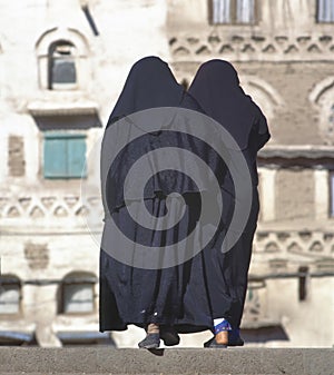 Two women in a black burka