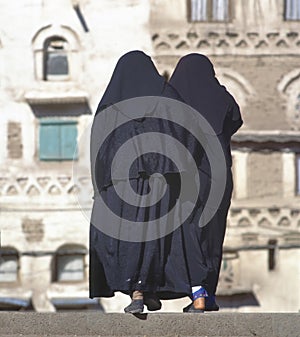 Two women in a black burka photo