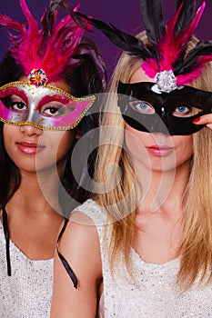 Two women with carnival venetian masks