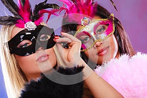 Two women with carnival venetian masks