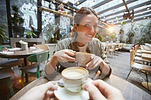 Two Women Chattering over Coffee