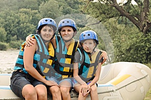 Two women and a child going rafting
