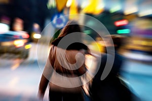 Two women at city centre at night