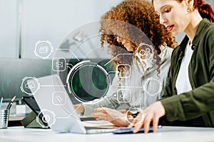 Two women coding together in a high-tech office, showcasing teamwork, software development, and female empowerment