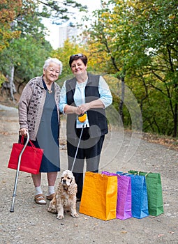 Two women with colotful shopping bags