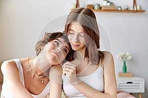 Two women in comfy attire sitting