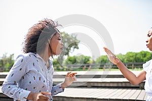 Two women confronting and arguing with each other.