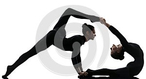 Two women contortionist exercising gymnastic yoga