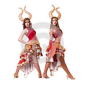 Two women dancers with horns. Isolated on white