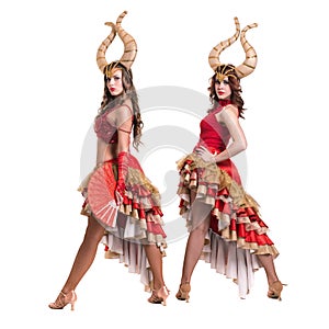 Two women dancers with horns. Isolated on white background.