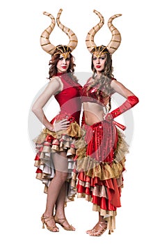 Two women dancers with horns. Isolated on white background.