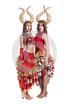 Two women dancers with horns. Isolated on white background.