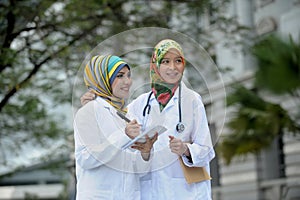 Two Women Doctor With Scarf, Outdoor