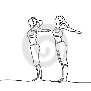 Two women doing exercise in yoga pose
