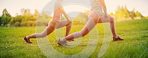 Two women doing fitness workout in active wear in nature.