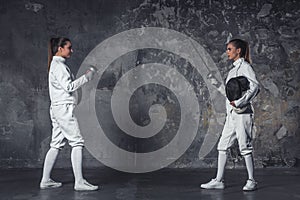 Two women fencing