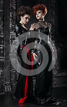 Two women in fetish costumes photo
