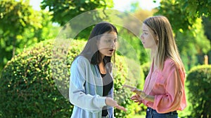 Two women friends quarrelling, dont want to listen to each other, confrontation