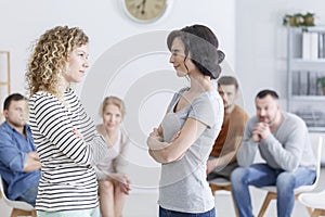 Two women during group psychotherapy photo