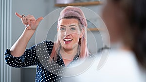 Two Women Having Conversation At Home Using Sign Language