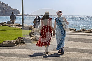 Two Women Holding Hands on the Tel Aviv Promenade