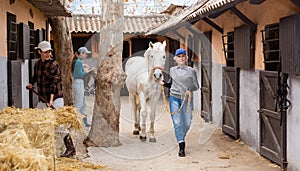 Two women horsebreeders working in ranch