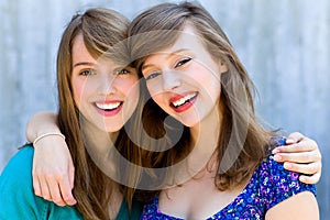 Two women hugging and smiling